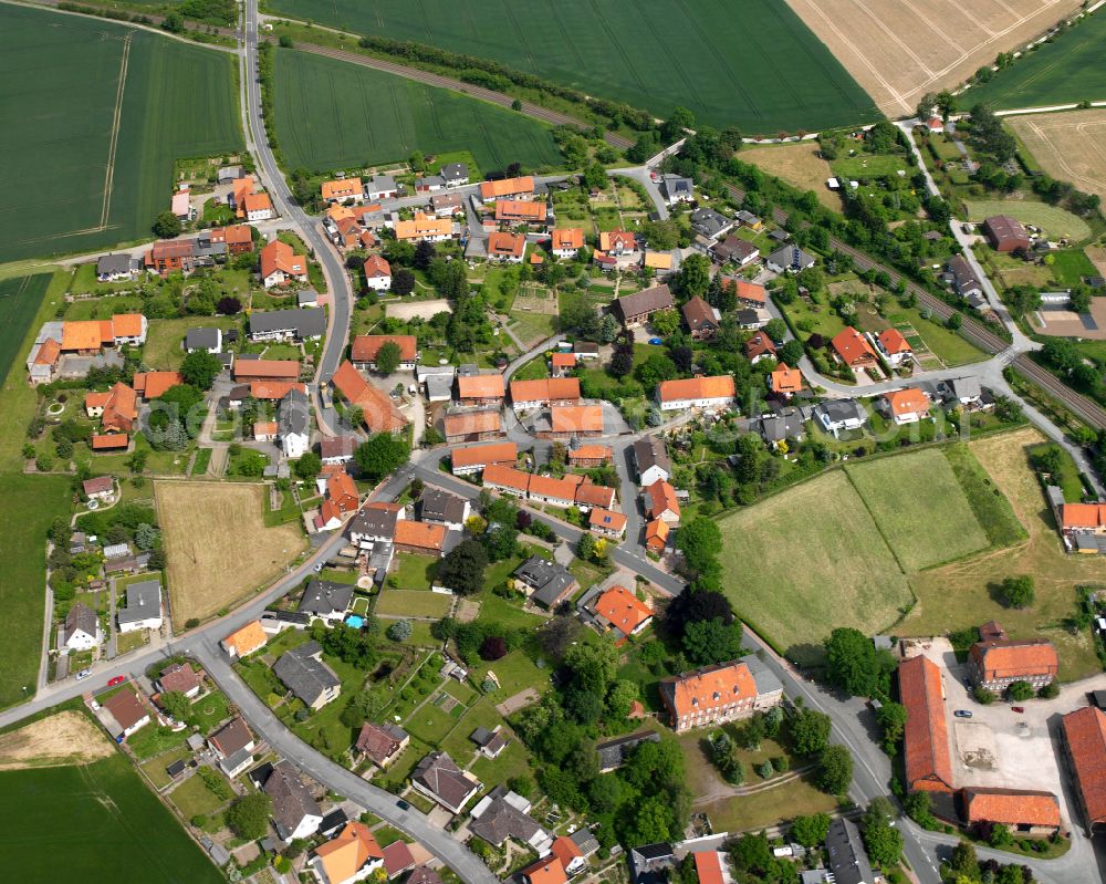 Heißum from the bird's eye view: Agricultural land and field boundaries surround the settlement area of the village in Heißum in the state Lower Saxony, Germany