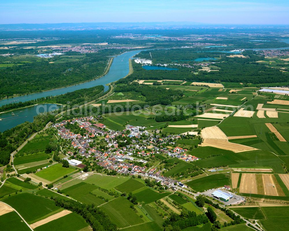 Helmlingen from above - Agricultural land and field boundaries surround the settlement area of the village in Helmlingen in the state Baden-Wuerttemberg, Germany