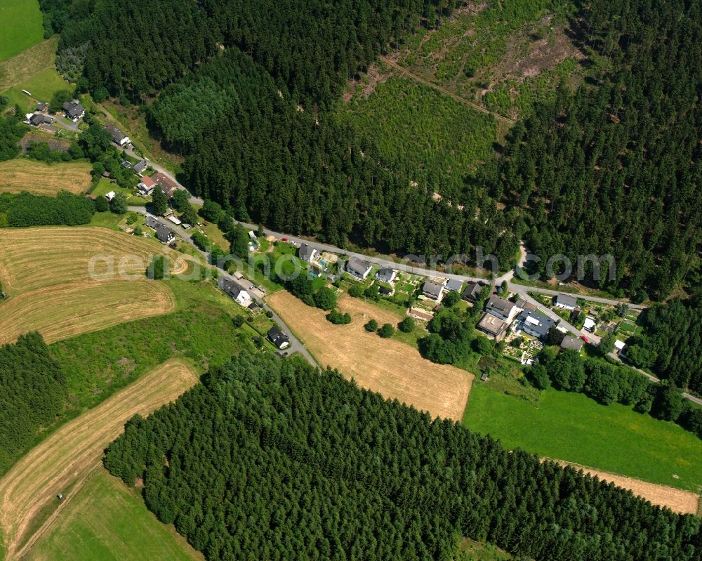 Hemschlar from the bird's eye view: Agricultural land and field boundaries surround the settlement area of the village in Hemschlar in the state North Rhine-Westphalia, Germany