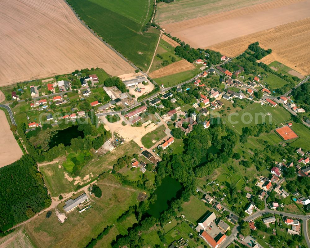 Aerial image Hermsdorf - Agricultural land and field boundaries surround the settlement area of the village in Hermsdorf Mansfeld in the state Saxony-Anhalt, Germany