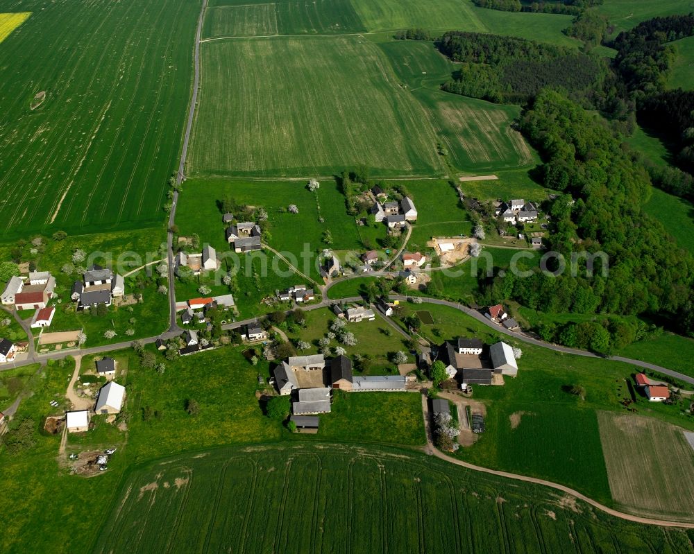 Aerial image Hermsdorf - Agricultural land and field boundaries surround the settlement area of the village in Hermsdorf in the state Saxony, Germany