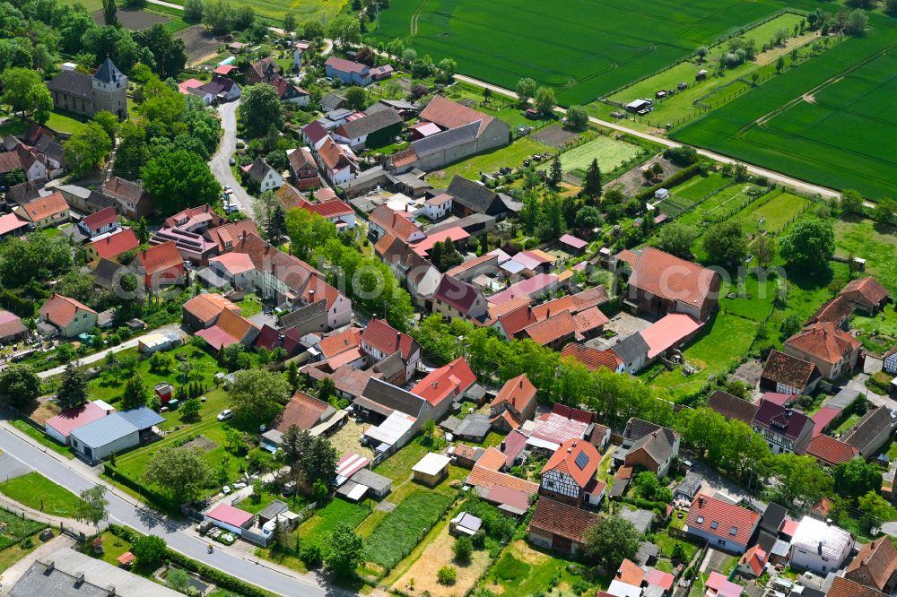 Aerial image Herrnschwende - Agricultural land and field boundaries surround the settlement area of the village in Herrnschwende in the state Thuringia, Germany