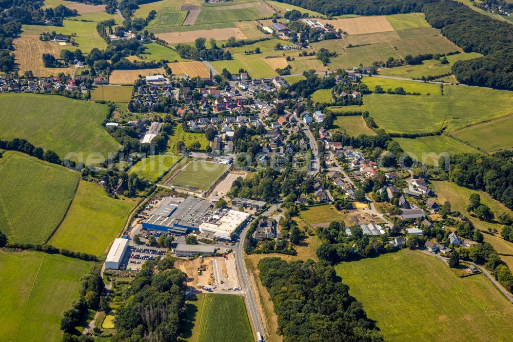 Herzkamp from the bird's eye view: Agricultural land and field boundaries surround the settlement area of the village in Herzkamp in the state North Rhine-Westphalia, Germany