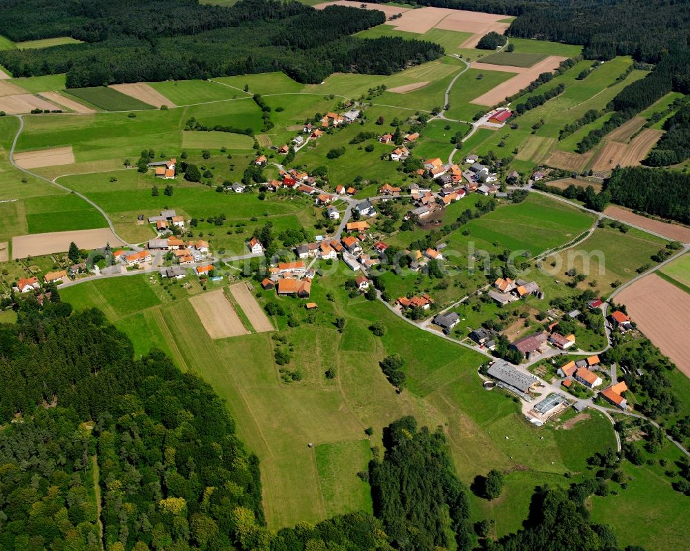 Hesselbach from the bird's eye view: Agricultural land and field boundaries surround the settlement area of the village in Hesselbach in the state Hesse, Germany