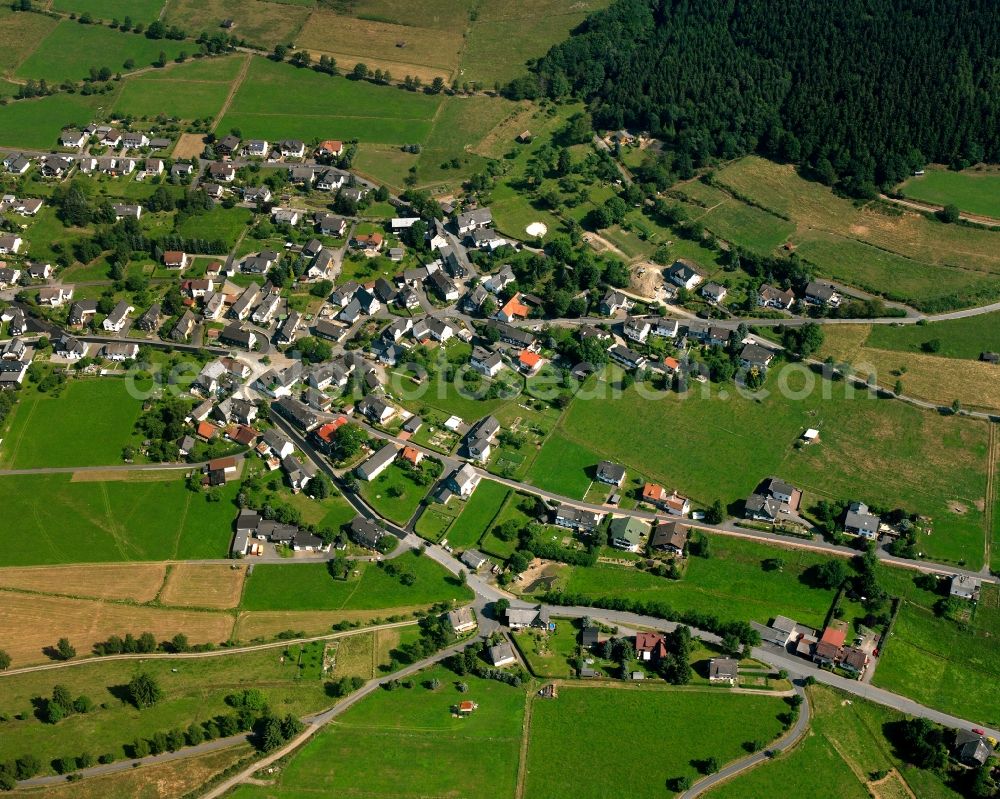 Aerial image Hesselbach - Agricultural land and field boundaries surround the settlement area of the village in Hesselbach at Siegerland in the state North Rhine-Westphalia, Germany