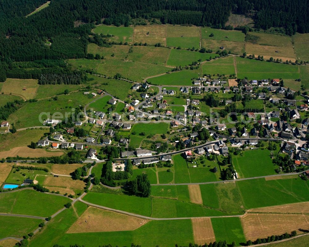 Aerial photograph Hesselbach - Agricultural land and field boundaries surround the settlement area of the village in Hesselbach at Siegerland in the state North Rhine-Westphalia, Germany