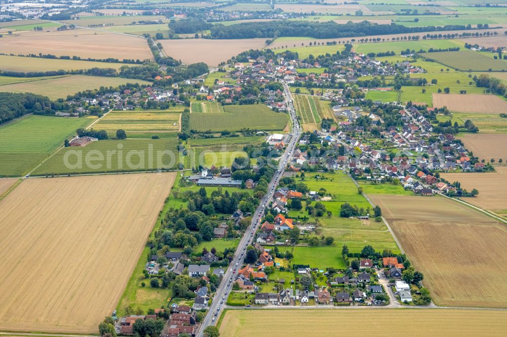 Aerial image Hilbeck - Agricultural land and field boundaries surround the settlement area of the village in Hilbeck in the state North Rhine-Westphalia, Germany