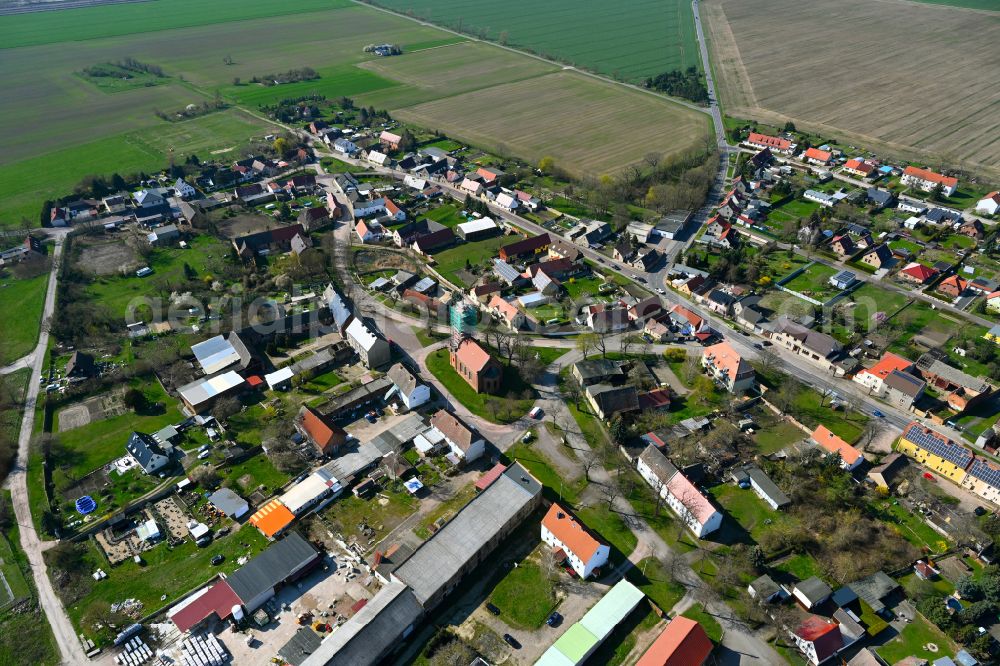 Hinsdorf from above - Agricultural land and field boundaries surround the settlement area of the village in Hinsdorf in the state Saxony-Anhalt, Germany