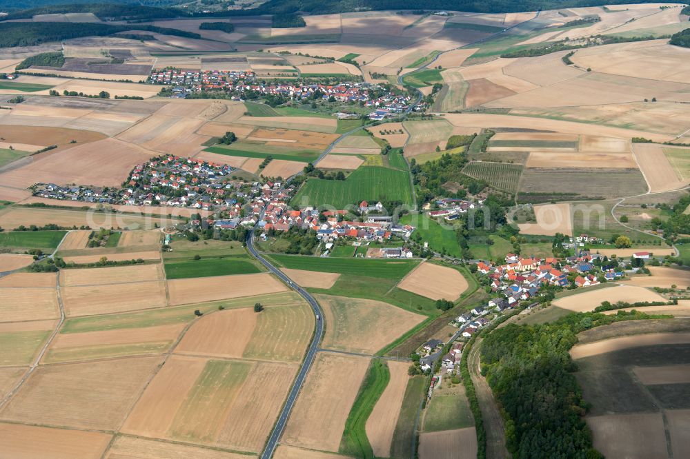 Aerial photograph Höllrich - Agricultural land and field boundaries surround the settlement area of the village in Höllrich in the state Bavaria, Germany