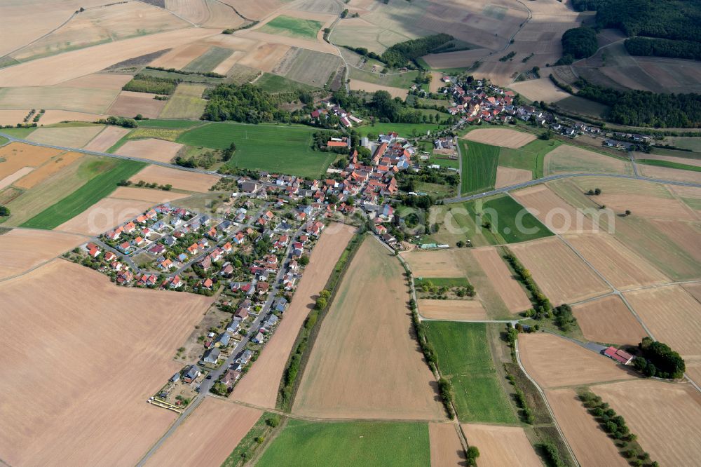 Höllrich from the bird's eye view: Agricultural land and field boundaries surround the settlement area of the village in Höllrich in the state Bavaria, Germany