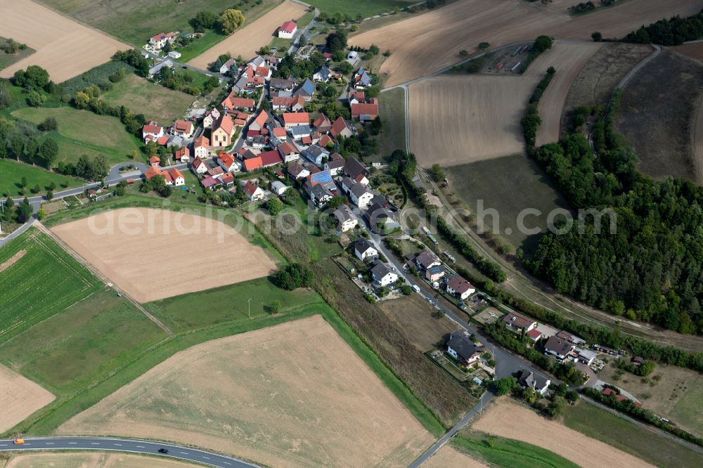 Höllrich from above - Agricultural land and field boundaries surround the settlement area of the village in Höllrich in the state Bavaria, Germany