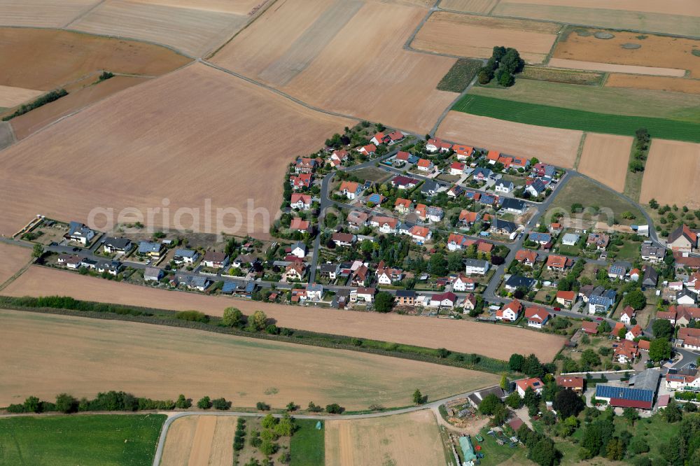 Höllrich from the bird's eye view: Agricultural land and field boundaries surround the settlement area of the village in Höllrich in the state Bavaria, Germany