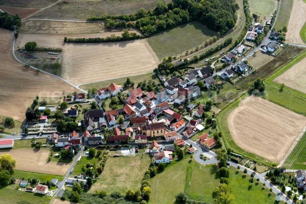 Höllrich from above - Agricultural land and field boundaries surround the settlement area of the village in Höllrich in the state Bavaria, Germany