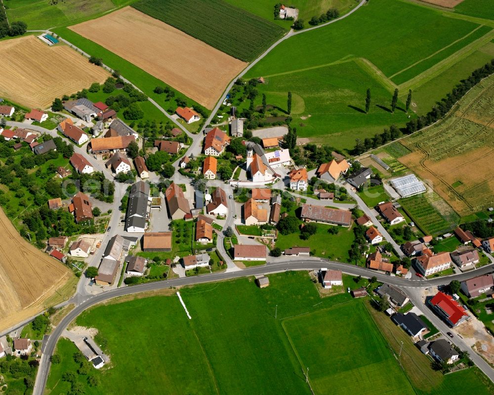 Hochberg from above - Agricultural land and field boundaries surround the settlement area of the village in Hochberg in the state Baden-Wuerttemberg, Germany