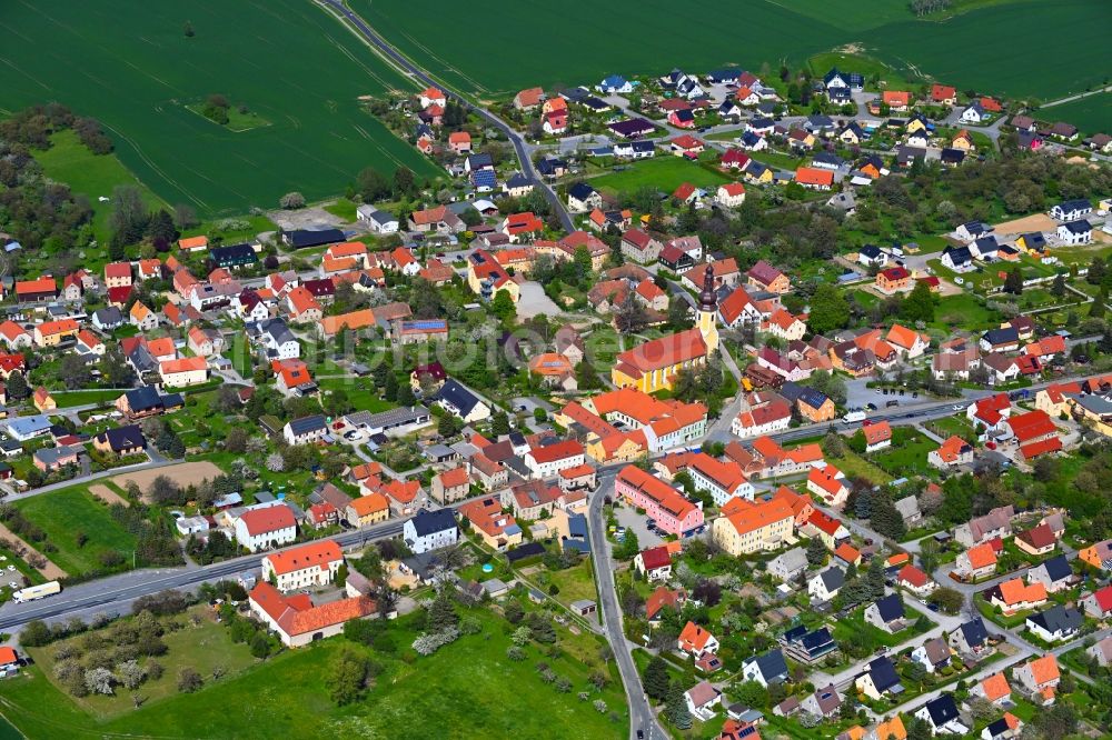 Aerial image Hochkirch - Agricultural land and field boundaries surround the settlement area of the village along Karl-Marx-Strasse in Hochkirch in the state Saxony, Germany