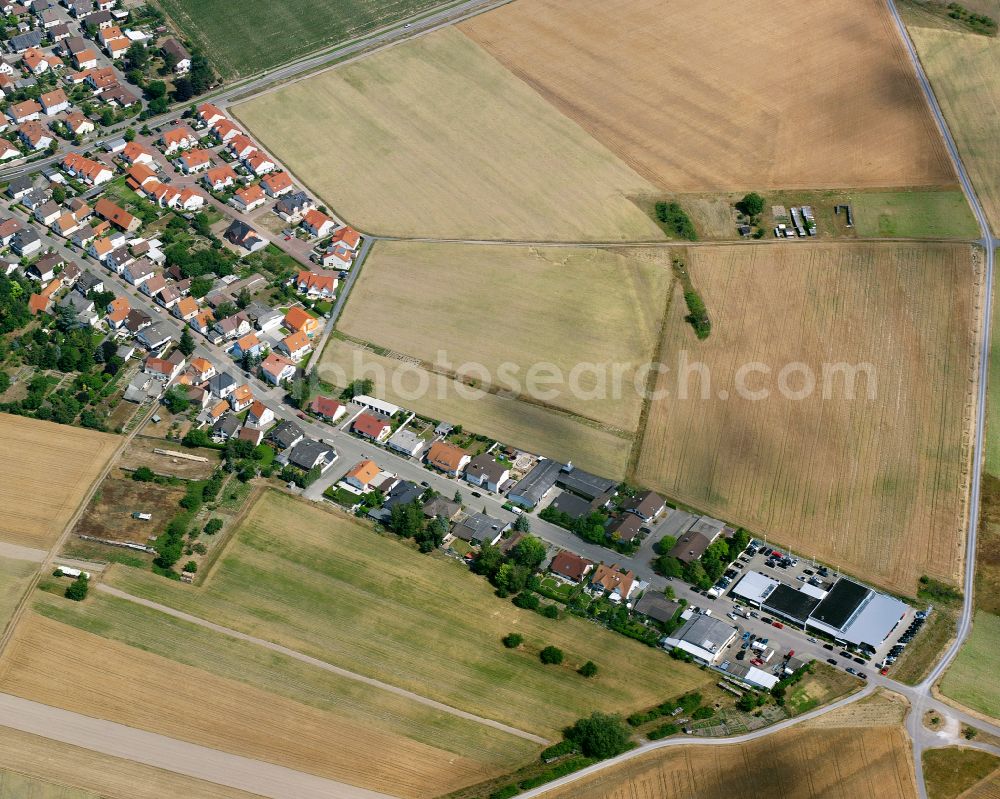 Hochstetten from the bird's eye view: Agricultural land and field boundaries surround the settlement area of the village in Hochstetten in the state Baden-Wuerttemberg, Germany