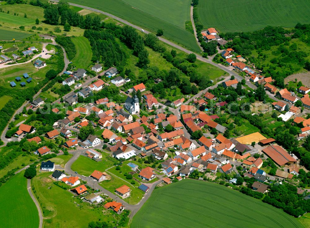 Hoferhof from above - Agricultural land and field boundaries surround the settlement area of the village in Hoferhof in the state Rhineland-Palatinate, Germany