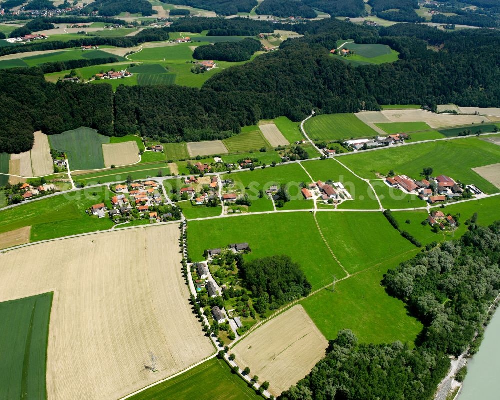 Aerial photograph Hofschallern - Agricultural land and field boundaries surround the settlement area of the village in Hofschallern in the state Bavaria, Germany