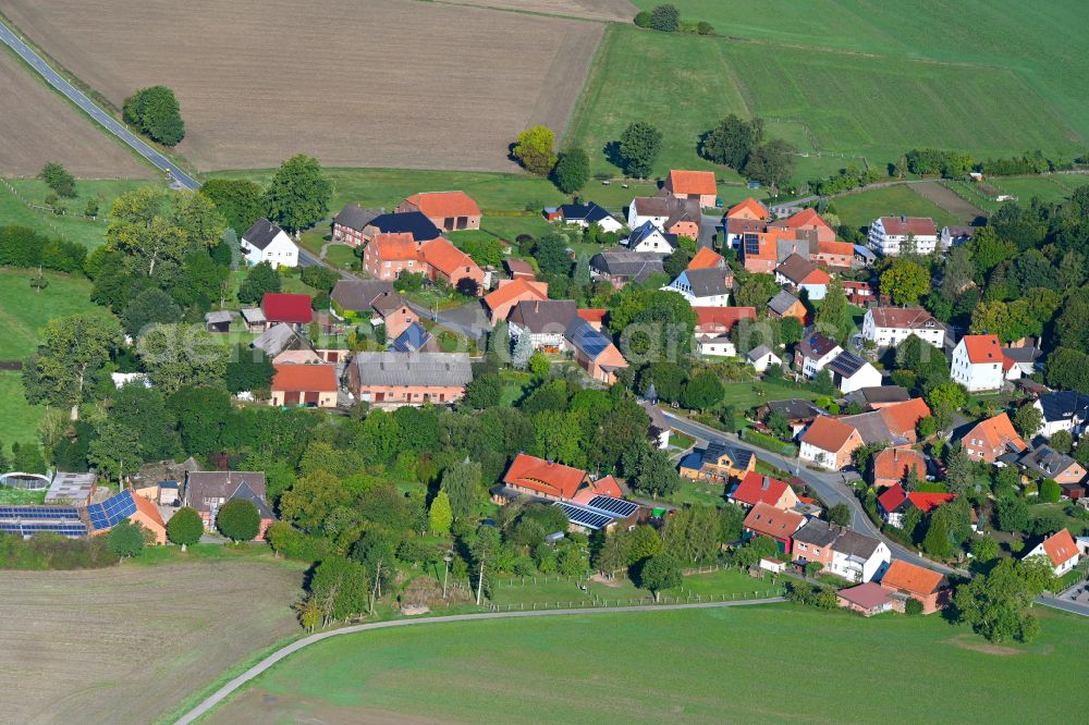 Hohehaus from above - Agricultural land and field boundaries surround the settlement area of the village in Hohehaus in the state North Rhine-Westphalia, Germany