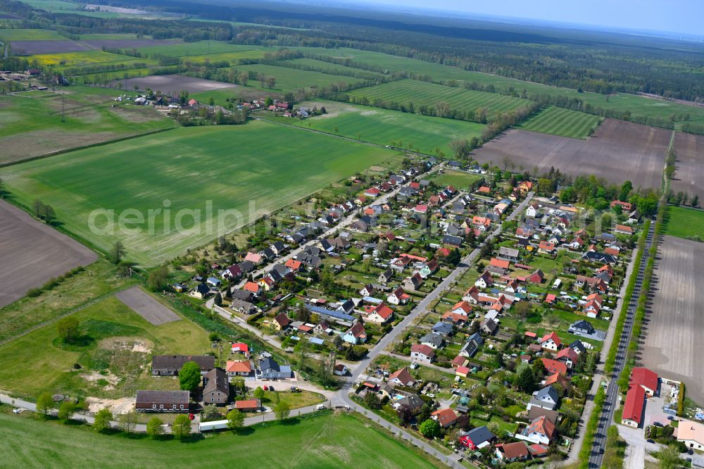 Hohenbruch from above - Agricultural land and field boundaries surround the settlement area of the village in Hohenbruch in the state Brandenburg, Germany