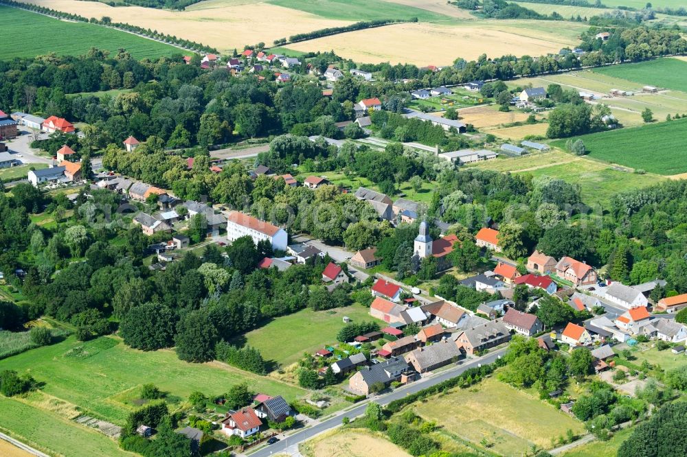 Hohenfinow from the bird's eye view: Agricultural land and field boundaries surround the settlement area of the village in Hohenfinow in the state Brandenburg, Germany