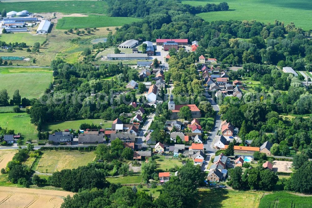 Hohenfinow from above - Agricultural land and field boundaries surround the settlement area of the village in Hohenfinow in the state Brandenburg, Germany