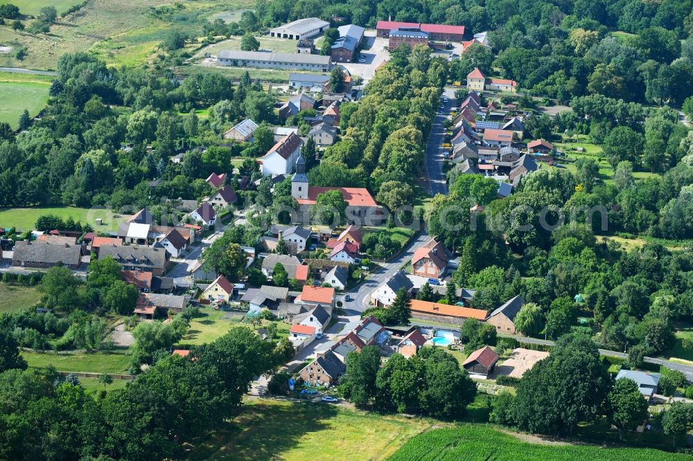 Hohenfinow from the bird's eye view: Agricultural land and field boundaries surround the settlement area of the village in Hohenfinow in the state Brandenburg, Germany