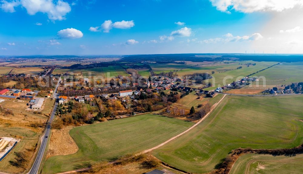 Hohenfinow from above - Agricultural land and field boundaries surround the settlement area of the village in Hohenfinow in the state Brandenburg, Germany