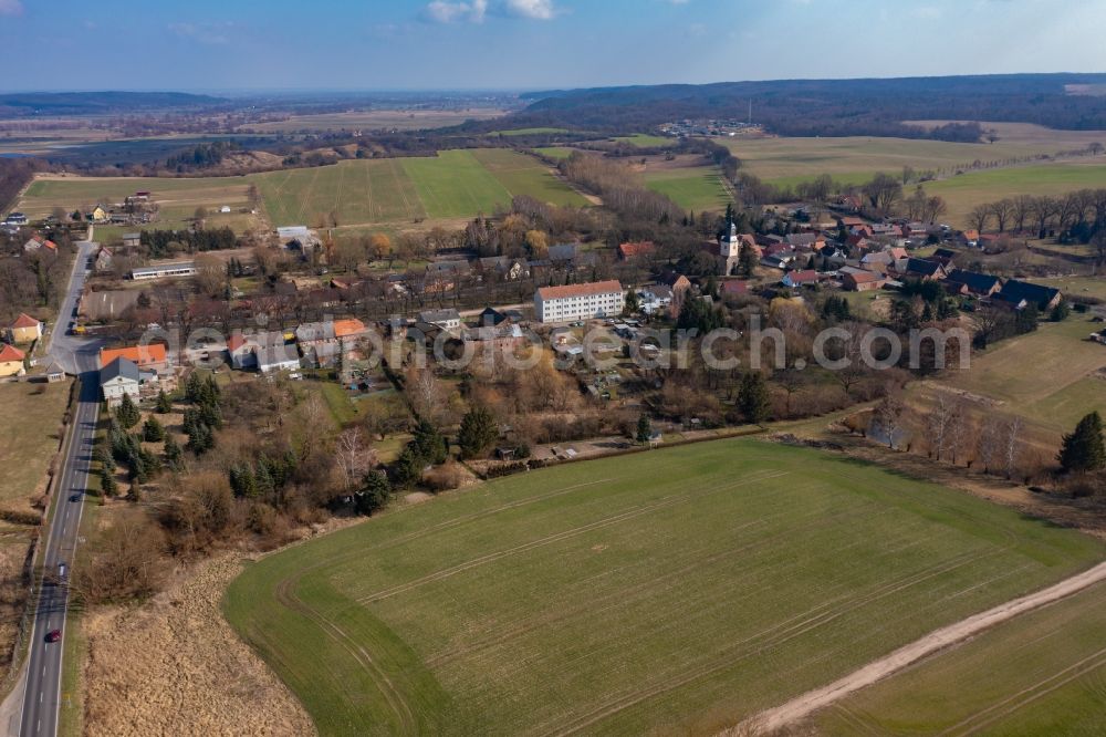 Hohenfinow from the bird's eye view: Agricultural land and field boundaries surround the settlement area of the village in Hohenfinow in the state Brandenburg, Germany