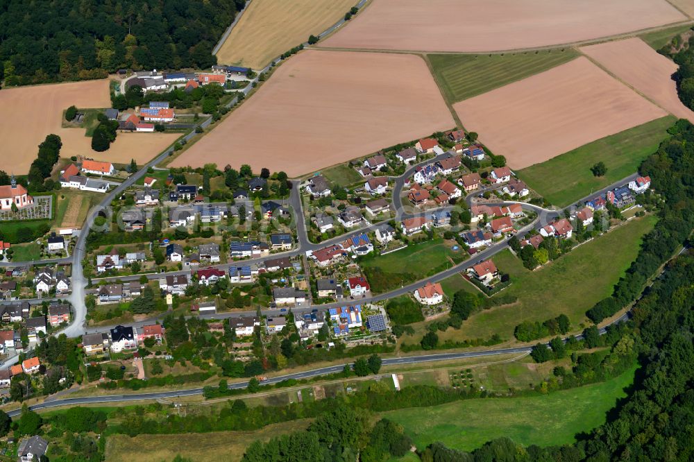 Aerial image Holzkirchen - Agricultural land and field boundaries surround the settlement area of the village in Holzkirchen in the state Bavaria, Germany