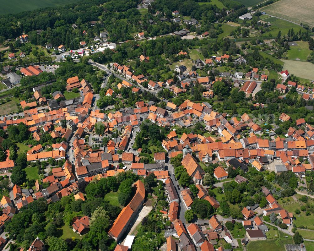 Hornburg from above - Agricultural land and field boundaries surround the settlement area of the village in Hornburg in the state Lower Saxony, Germany