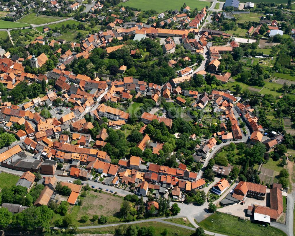 Hornburg from the bird's eye view: Agricultural land and field boundaries surround the settlement area of the village in Hornburg in the state Lower Saxony, Germany