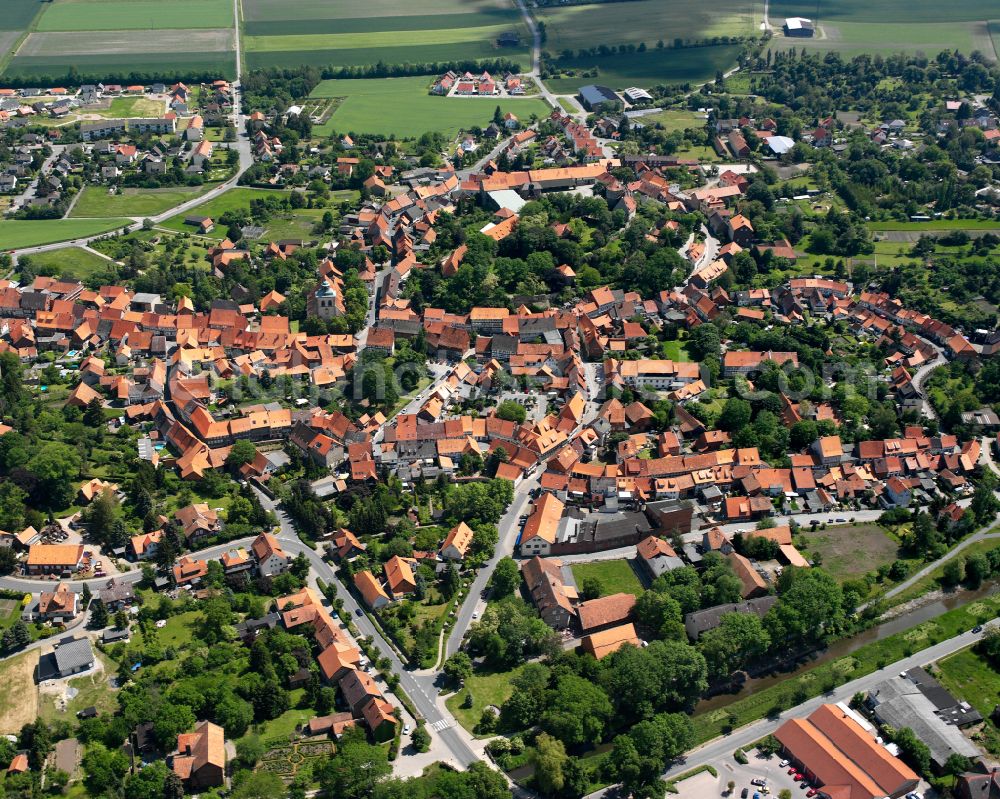 Aerial image Hornburg - Agricultural land and field boundaries surround the settlement area of the village in Hornburg in the state Lower Saxony, Germany