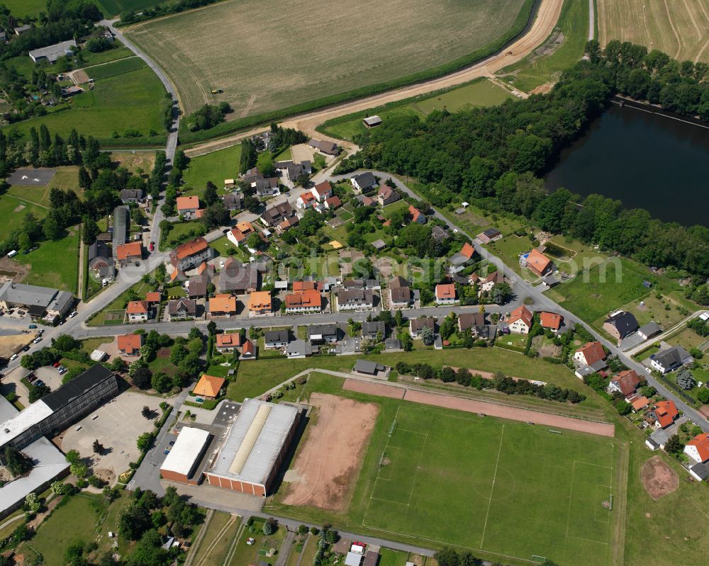 Hornburg from the bird's eye view: Agricultural land and field boundaries surround the settlement area of the village in Hornburg in the state Lower Saxony, Germany