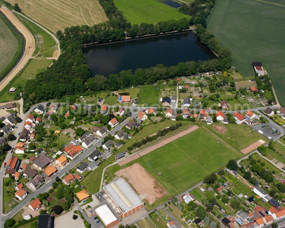 Aerial image Hornburg - Agricultural land and field boundaries surround the settlement area of the village in Hornburg in the state Lower Saxony, Germany