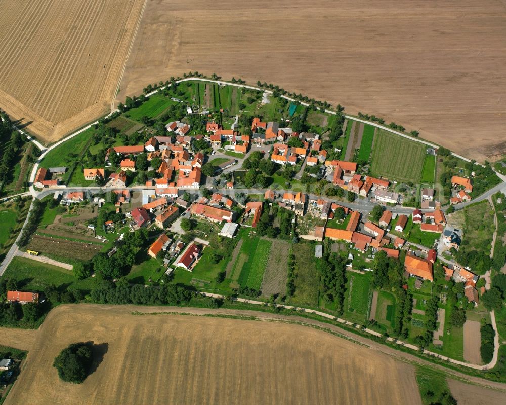 Hornsömmern from above - Agricultural land and field boundaries surround the settlement area of the village in Hornsömmern in the state Thuringia, Germany