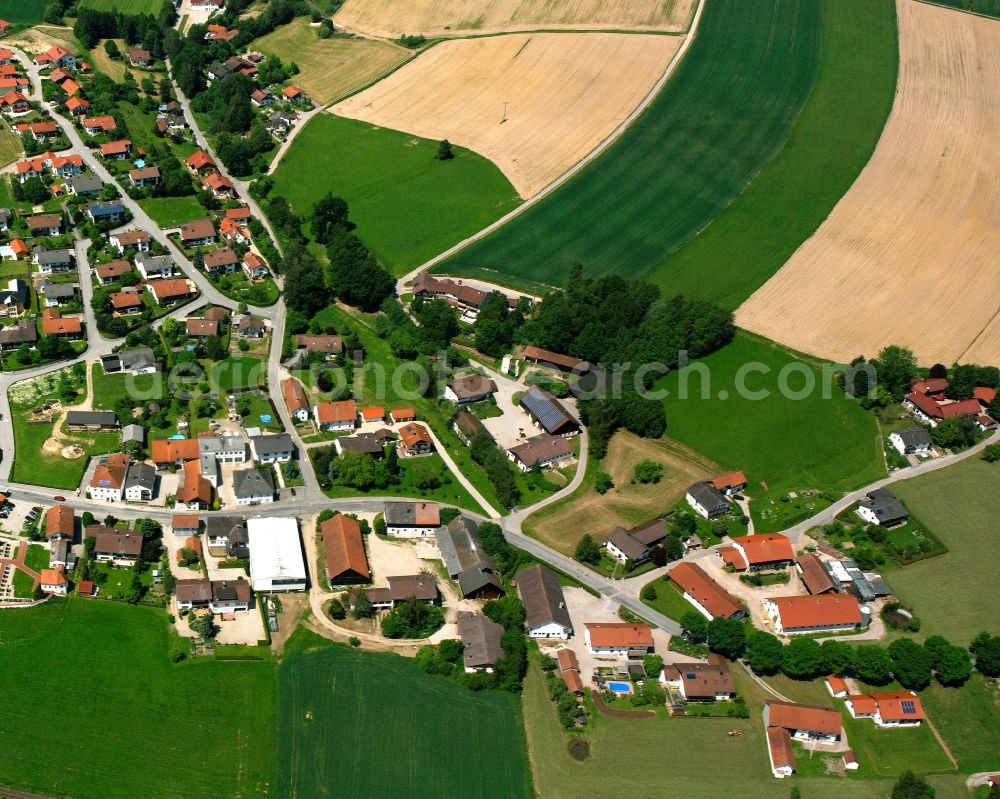 Aerial image Huldsessen - Agricultural land and field boundaries surround the settlement area of the village in Huldsessen in the state Bavaria, Germany