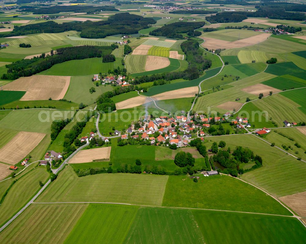 Hummertsried from above - Agricultural land and field boundaries surround the settlement area of the village in Hummertsried in the state Baden-Wuerttemberg, Germany