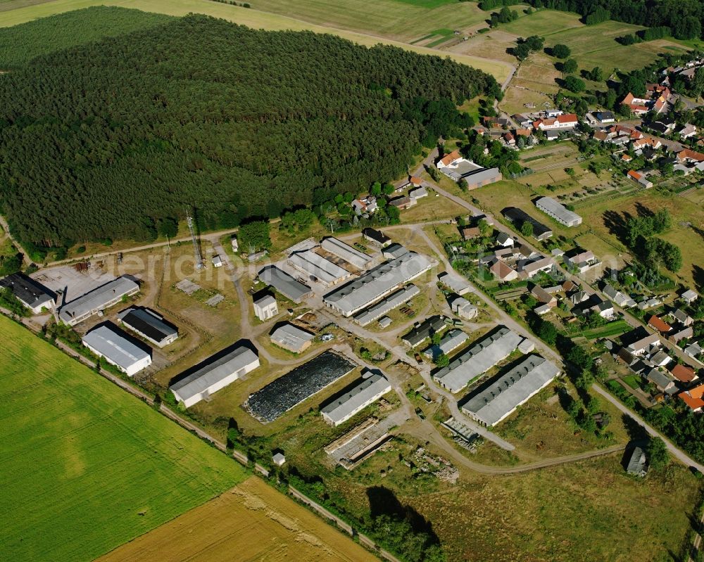 Hundeluft from above - Agricultural land and field boundaries surround the settlement area of the village in Hundeluft in the state Saxony-Anhalt, Germany