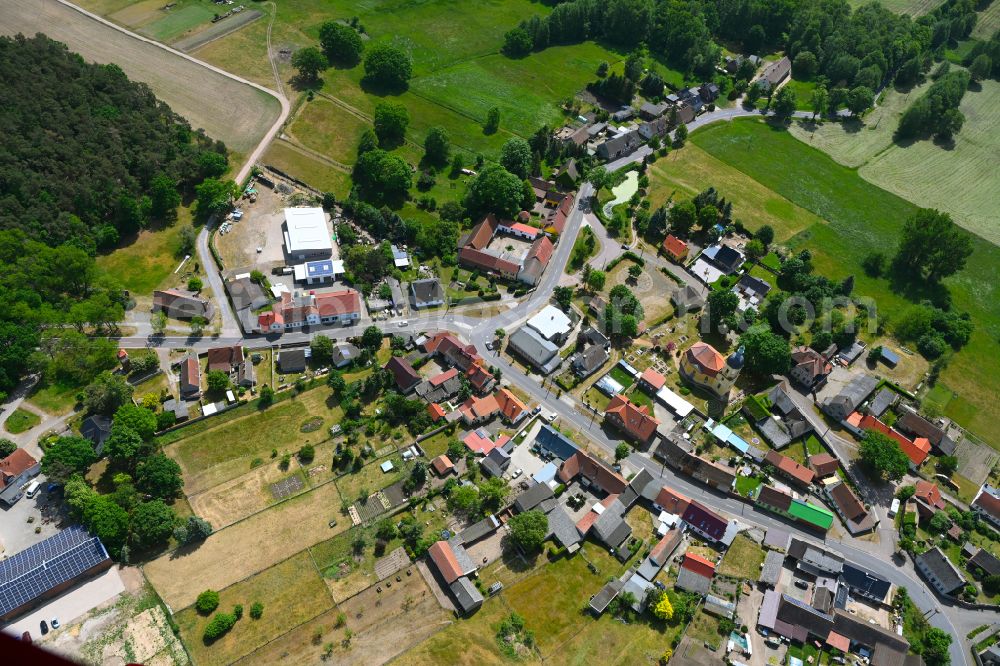 Hundeluft from above - Agricultural land and field boundaries surround the settlement area of the village in Hundeluft in the state Saxony-Anhalt, Germany