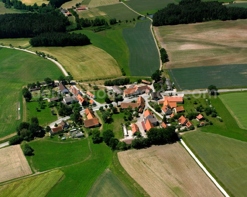 Aerial image Häuslingen - Agricultural land and field boundaries surround the settlement area of the village in Häuslingen in the state Bavaria, Germany