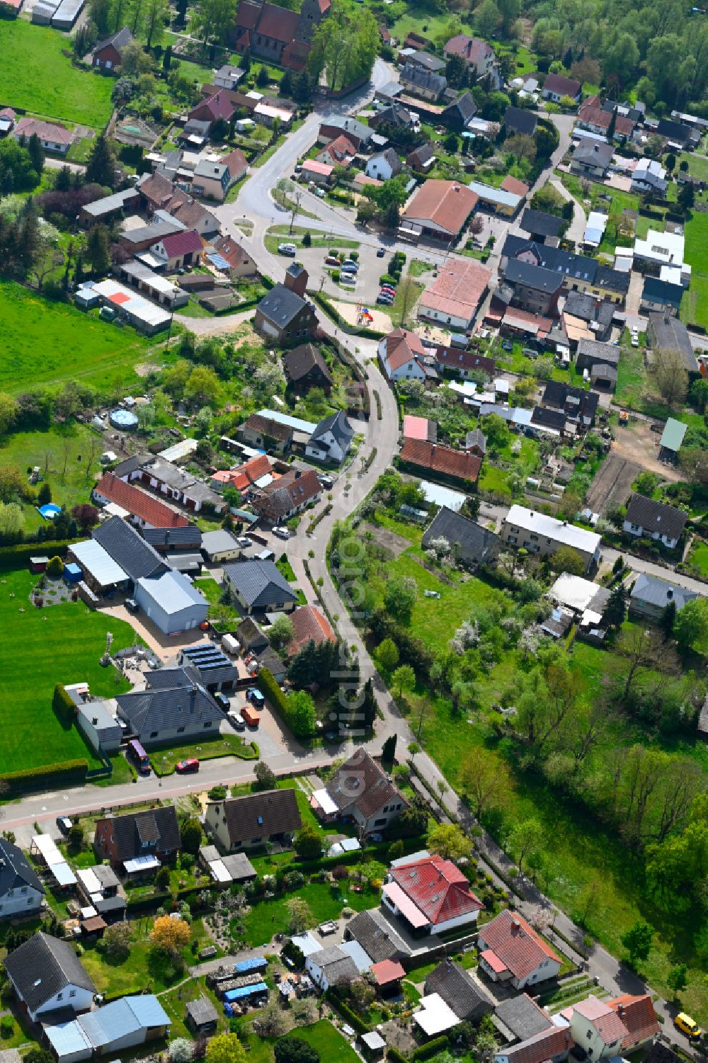 Aerial image Iden - Agricultural land and field boundaries surround the settlement area of the village in Iden in the state Saxony-Anhalt, Germany