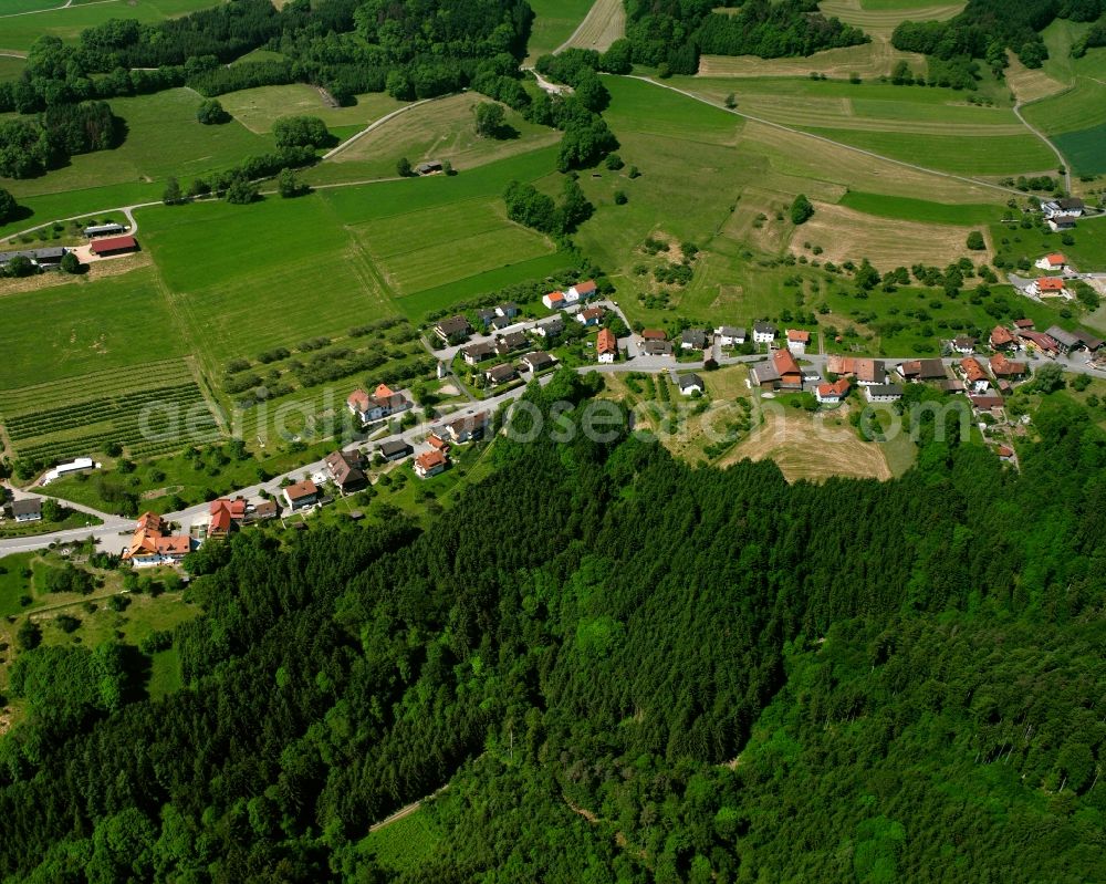 Aerial photograph Indlekofen - Agricultural land and field boundaries surround the settlement area of the village in Indlekofen in the state Baden-Wuerttemberg, Germany