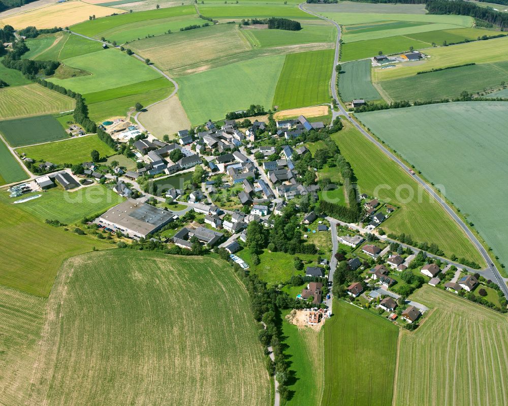 Aerial image Isaar - Agricultural land and field boundaries surround the settlement area of the village in Isaar in the state Bavaria, Germany