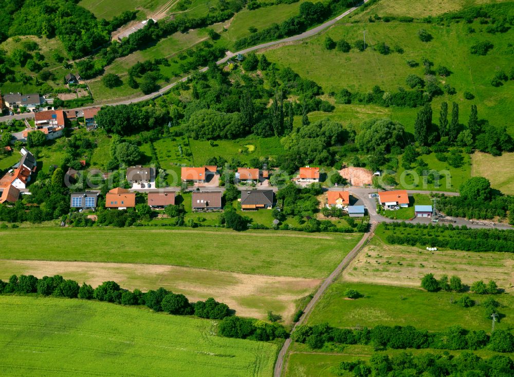 Jakobsweiler from above - Agricultural land and field boundaries surround the settlement area of the village in Jakobsweiler in the state Rhineland-Palatinate, Germany