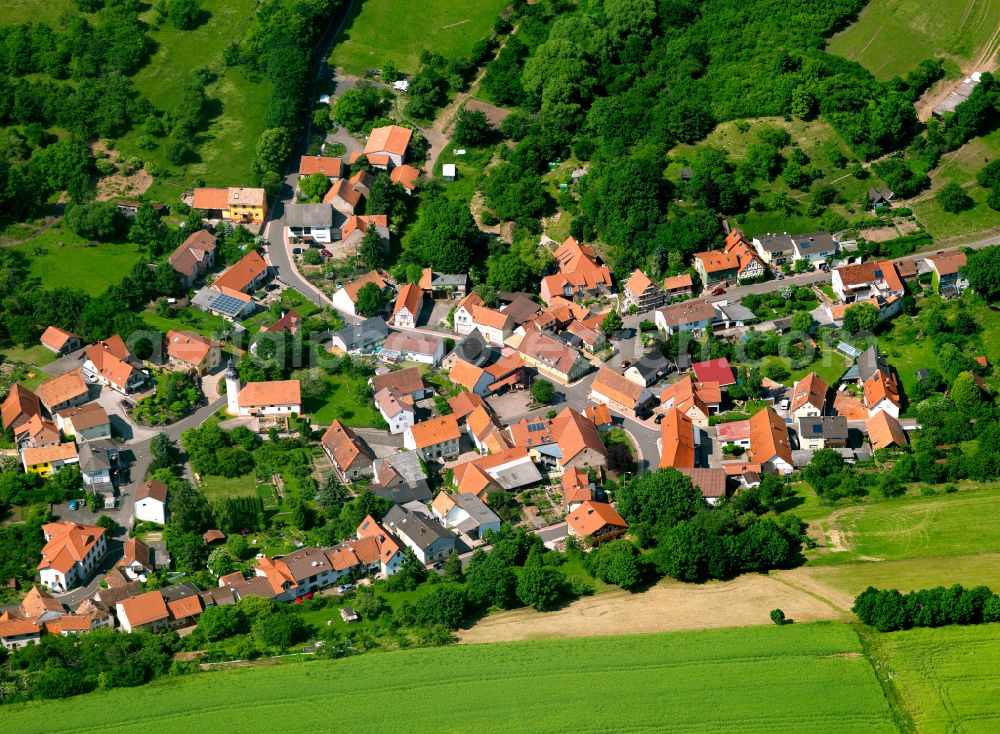 Jakobsweiler from the bird's eye view: Agricultural land and field boundaries surround the settlement area of the village in Jakobsweiler in the state Rhineland-Palatinate, Germany