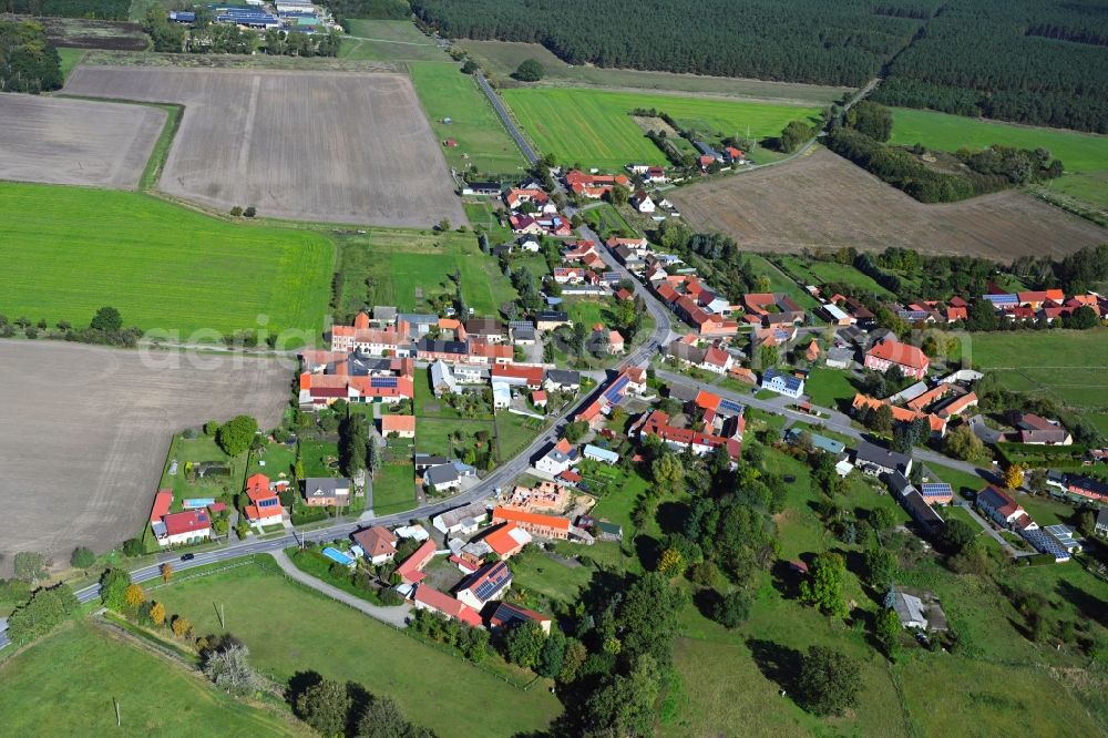 Jerchel from above - Agricultural land and field boundaries surround the settlement area of the village in Jerchel in the state Saxony-Anhalt, Germany