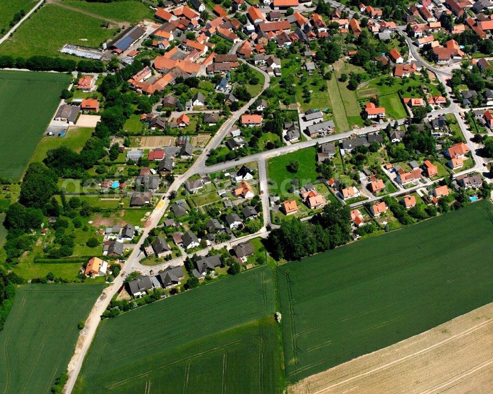 Jühnde from above - Agricultural land and field boundaries surround the settlement area of the village in Jühnde in the state Lower Saxony, Germany