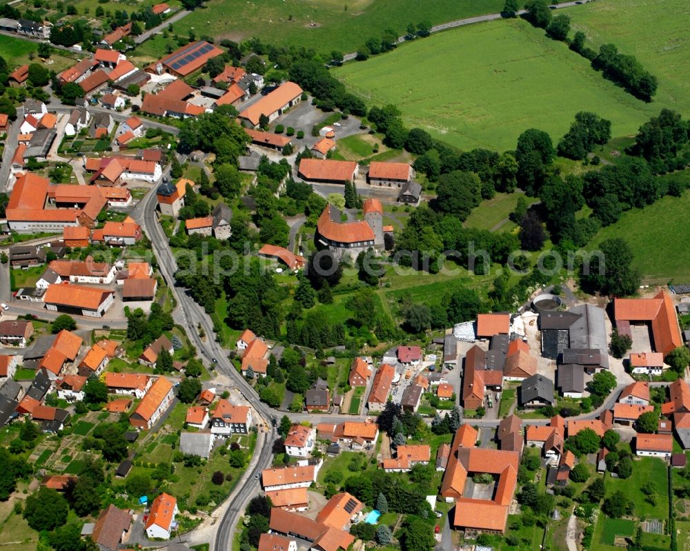 Aerial image Jühnde - Agricultural land and field boundaries surround the settlement area of the village in Jühnde in the state Lower Saxony, Germany