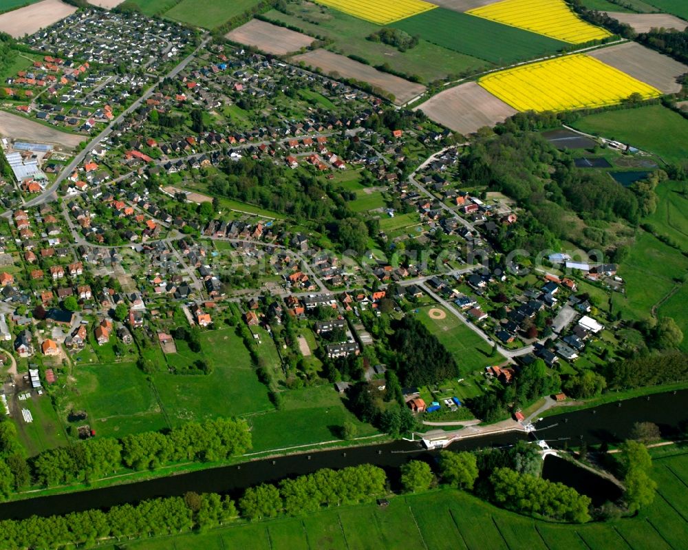 Aerial image St. Jürgen - Agricultural land and field boundaries surround the settlement area of the village in St. Jürgen in the state Schleswig-Holstein, Germany